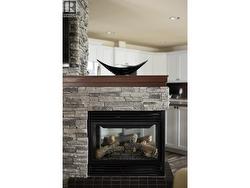 3 way fireplace in central stone hearth - 