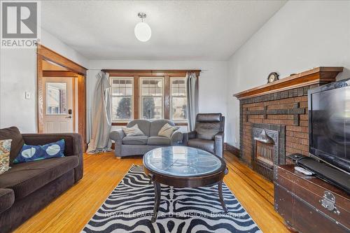 59 Paisley Avenue S, Hamilton, ON - Indoor Photo Showing Living Room With Fireplace
