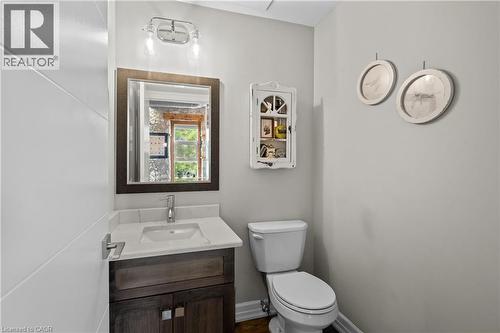 Half bathroom featuring vanity and toilet - 25 Concession Street Unit# 201, Cambridge, ON - Indoor Photo Showing Bathroom