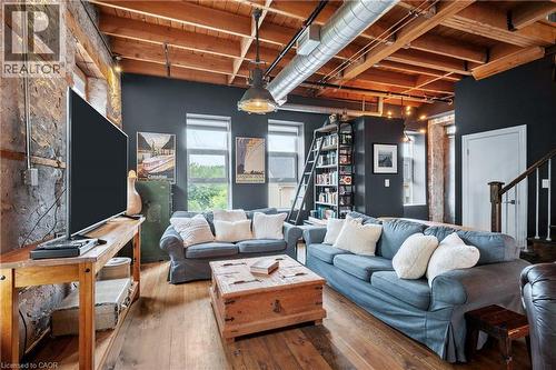 Living area with wood-type flooring and beam ceiling - 25 Concession Street Unit# 201, Cambridge, ON - Indoor