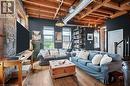 Living area with wood-type flooring and beam ceiling - 25 Concession Street Unit# 201, Cambridge, ON  - Indoor 