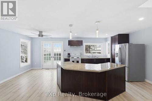 Back deck doors/ kitchen - 60 Main Street E, Mapleton, ON - Indoor Photo Showing Kitchen With Upgraded Kitchen
