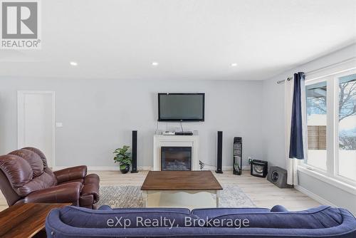 Fireplace and living area - 60 Main Street E, Mapleton, ON - Indoor Photo Showing Living Room With Fireplace