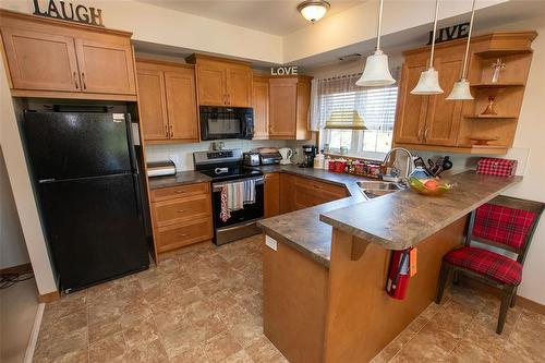 302 1223 Dawson Road, Lorette, MB - Indoor Photo Showing Kitchen With Double Sink