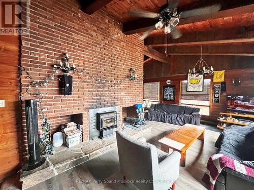 45 Ridgeway Drive, Carling, ON - Indoor Photo Showing Living Room With Fireplace