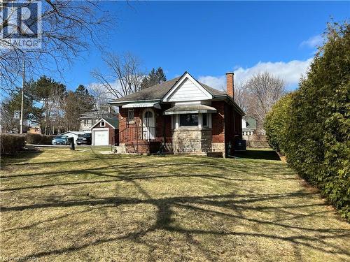 View of front of property stone siding, a front yard, brick construction - 90 Osler Drive, Dundas, ON - Outdoor