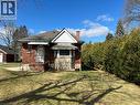 Bungalow-style house a front lawn, privacy hedge - 90 Osler Drive, Dundas, ON  - Outdoor 
