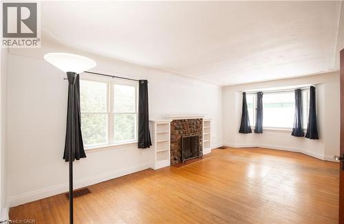 Dining room and living room - 90 Osler Drive, Dundas, ON - Indoor With Fireplace