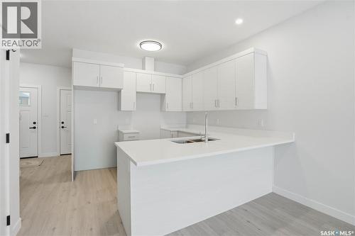 527 Sharma Crescent, Saskatoon, SK - Indoor Photo Showing Kitchen With Double Sink