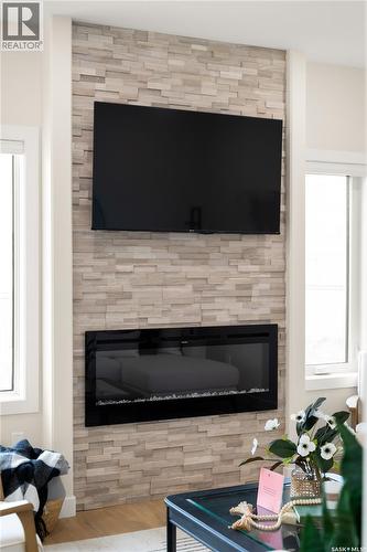 3 Vancouver Crescent, Pilot Butte, SK - Indoor Photo Showing Living Room With Fireplace