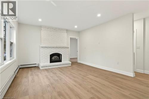 1012 North Shore Boulevard E, Burlington, ON - Indoor Photo Showing Living Room With Fireplace