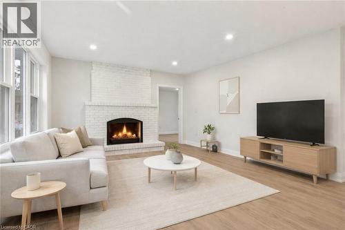 Virtually Staged - 1012 North Shore Boulevard E, Burlington, ON - Indoor Photo Showing Living Room With Fireplace