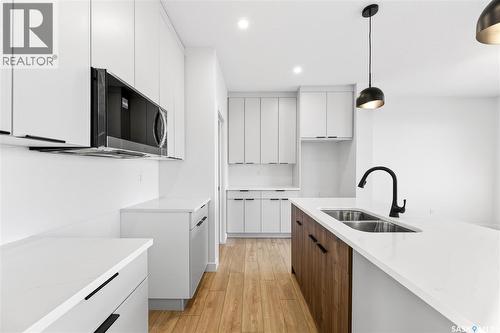 283 Nazarali Way, Saskatoon, SK - Indoor Photo Showing Kitchen With Double Sink