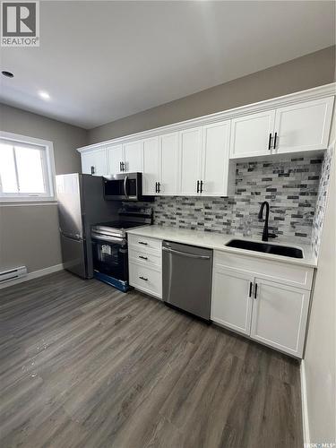 236 Barrett Street, Saskatoon, SK - Indoor Photo Showing Kitchen With Stainless Steel Kitchen With Double Sink With Upgraded Kitchen