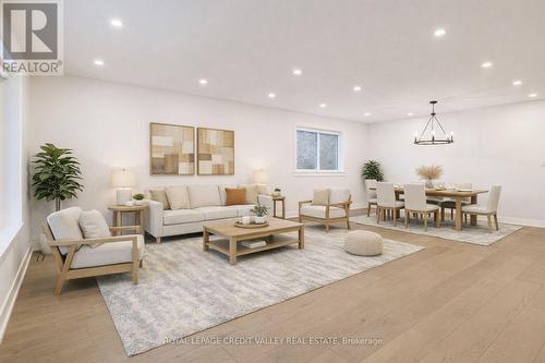 Virtually staged family room - 500 Selsey Drive, Mississauga, ON - Indoor Photo Showing Living Room