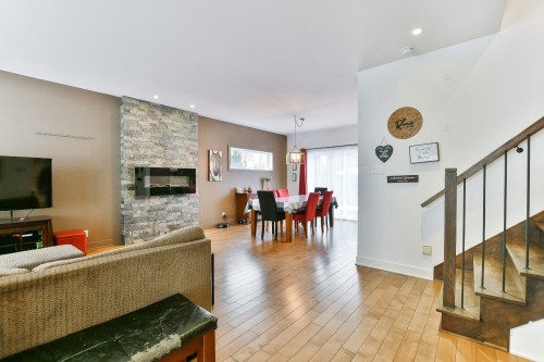 Vue - 2592 Rue Robindaine, L'Assomption, QC - Indoor Photo Showing Other Room With Fireplace