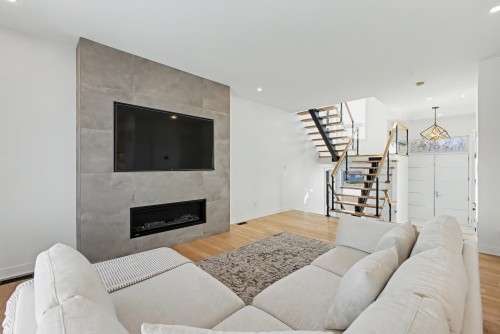 Living Room - 283 Rue De L'Aigle, Carignan, QC - Indoor Photo Showing Living Room With Fireplace
