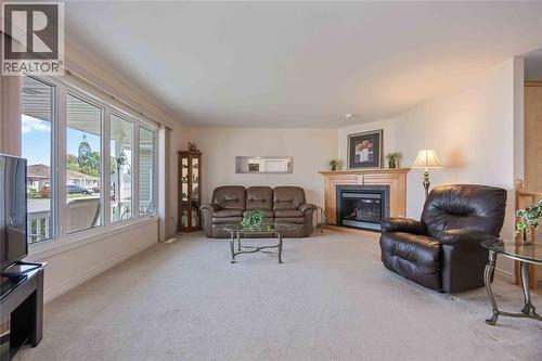 5700 Blackwell Sideroad Unit# 143, Sarnia, ON - Indoor Photo Showing Living Room With Fireplace