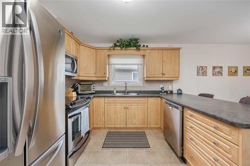 5700 Blackwell Sideroad Unit# 143, Sarnia, ON - Indoor Photo Showing Kitchen With Double Sink