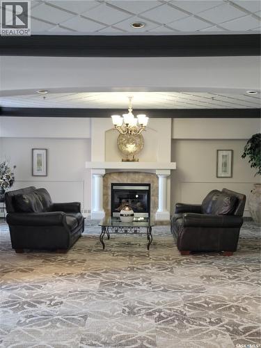 304 928 Heritage View, Saskatoon, SK - Indoor Photo Showing Other Room With Fireplace