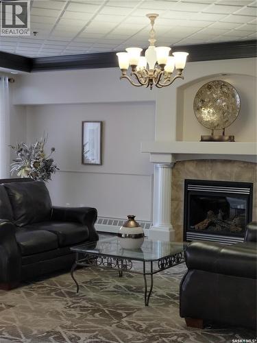 304 928 Heritage View, Saskatoon, SK - Indoor Photo Showing Living Room With Fireplace