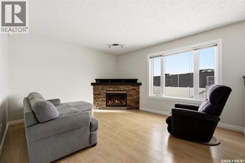 1368 Maple Leaf Crescent N, Regina, SK - Indoor Photo Showing Living Room With Fireplace