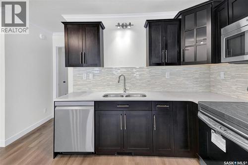 256 250 Akhtar Bend, Saskatoon, SK - Indoor Photo Showing Kitchen With Double Sink With Upgraded Kitchen
