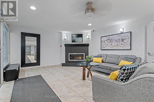 308 - 198 Scott Street, St. Catharines (Fairview), ON - Indoor Photo Showing Living Room With Fireplace