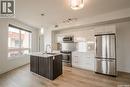 403 409 B Avenue S, Saskatoon, SK  - Indoor Photo Showing Kitchen With Stainless Steel Kitchen With Upgraded Kitchen 