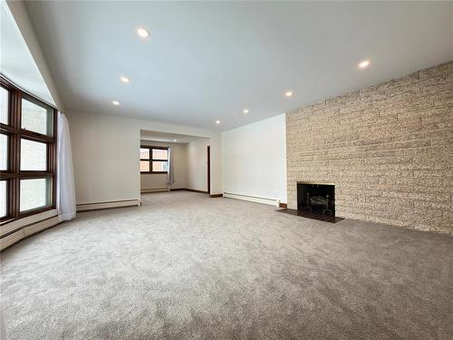 11 Meadowlark Place, Winnipeg, MB - Indoor Photo Showing Other Room With Fireplace