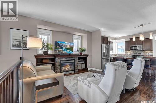 5117 Watson Way, Regina, SK - Indoor Photo Showing Living Room With Fireplace