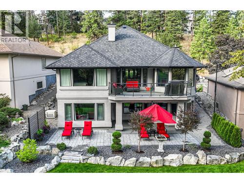 Lower level stone deck - 3907 Gallaghers Circle, Kelowna, BC - Outdoor With Deck Patio Veranda