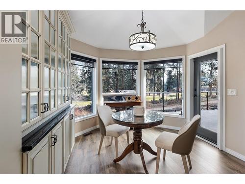 Outlook to 2nd hole from kitchen - 3907 Gallaghers Circle, Kelowna, BC - Indoor Photo Showing Dining Room