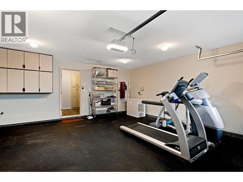 Heated garage - 3907 Gallaghers Circle, Kelowna, BC - Indoor Photo Showing Gym Room