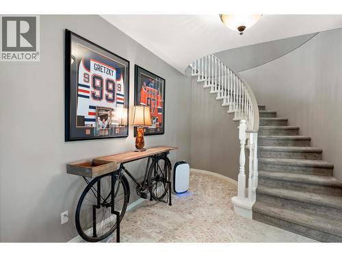 Spiral stairs to lower level - 3907 Gallaghers Circle, Kelowna, BC - Indoor Photo Showing Other Room