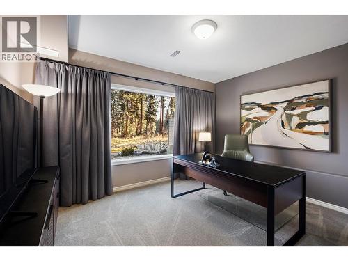 Lower level bedroom with view of golf course - 3907 Gallaghers Circle, Kelowna, BC - Indoor Photo Showing Other Room