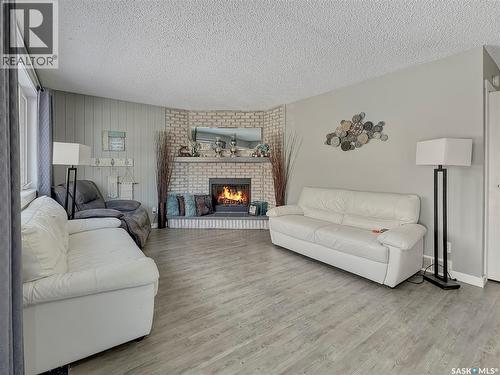 17 4Th Avenue E, Neilburg, SK - Indoor Photo Showing Living Room With Fireplace