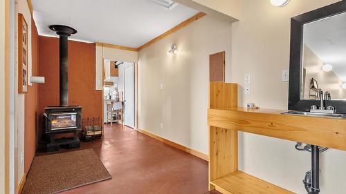 4751 40Th Street, Canyon, BC - Indoor Photo Showing Other Room With Fireplace