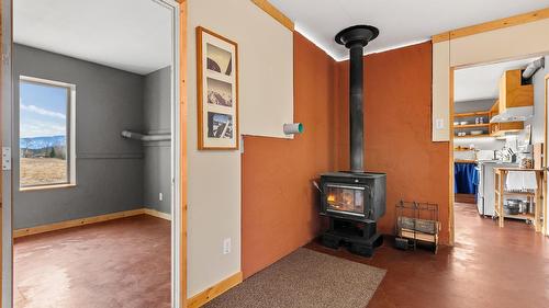 4751 40Th Street, Canyon, BC - Indoor Photo Showing Other Room With Fireplace