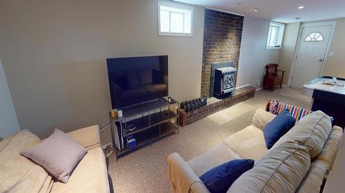 901 19Th Avenue, Cranbrook, BC - Indoor Photo Showing Other Room With Fireplace