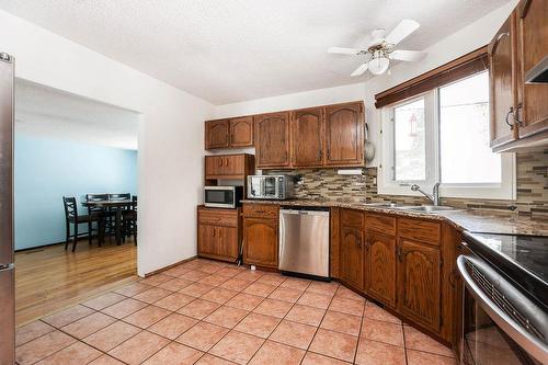 1957 Chancellor Drive, Winnipeg, MB - Indoor Photo Showing Kitchen With Stainless Steel Kitchen With Double Sink