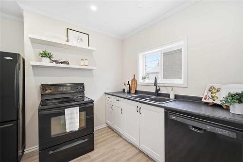 1240 Dominion Street, Winnipeg, MB - Indoor Photo Showing Kitchen With Double Sink