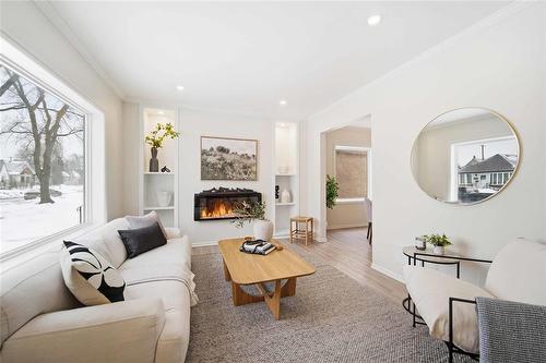 1240 Dominion Street, Winnipeg, MB - Indoor Photo Showing Living Room With Fireplace