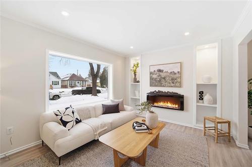 1240 Dominion Street, Winnipeg, MB - Indoor Photo Showing Living Room With Fireplace