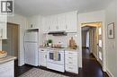 Kitchen featuring white appliances, white cabinetry, light countertops, and ventilation hood - 49 Dietz Avenue S, Waterloo, ON  - Indoor Photo Showing Kitchen 