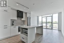 405 - 899 QUEEN STREET E Toronto, ON M4M 1J4