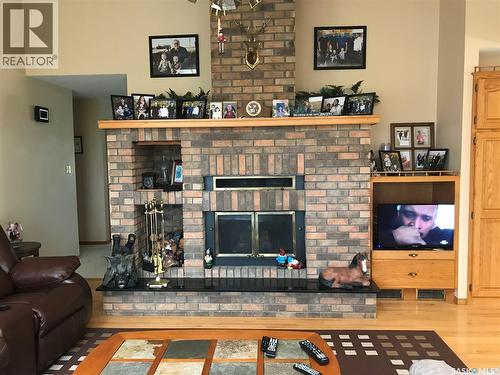 219 3Rd Street E, Odessa, SK - Indoor Photo Showing Living Room With Fireplace