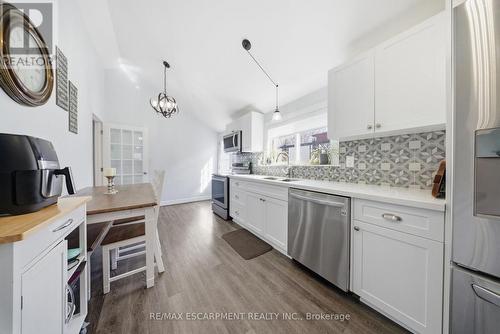 stone countertops & stainless steel appliances - 36 Queensdale Avenue W, Hamilton, ON - Indoor Photo Showing Kitchen With Upgraded Kitchen