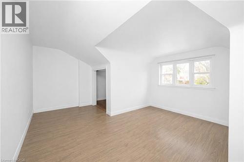 Bonus room featuring wood finished floors and vaulted ceiling - 43 Sterling Street, Hamilton, ON - Indoor Photo Showing Other Room