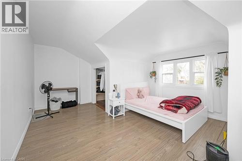 Bedroom featuring light wood-style floors and vaulted ceiling - 43 Sterling Street, Hamilton, ON - Indoor Photo Showing Bedroom
